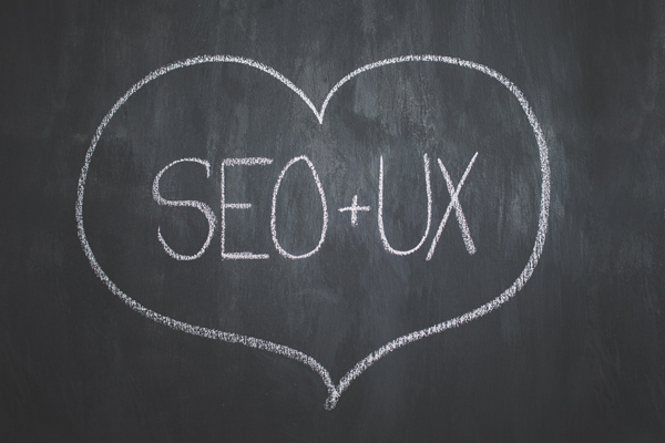 Blackboard with a SEO and UX text inside a love heart.